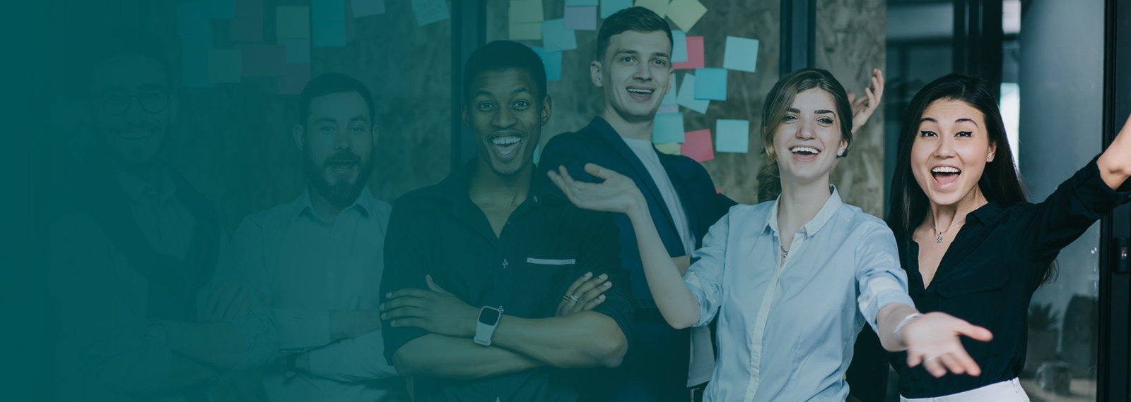 Image of a group of happy business people with a man in front giving a thumbs up