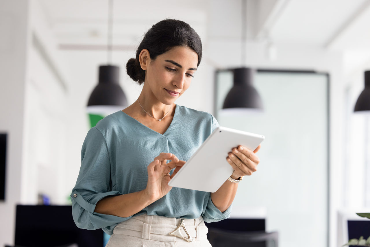 Woman using tablet in a modern office