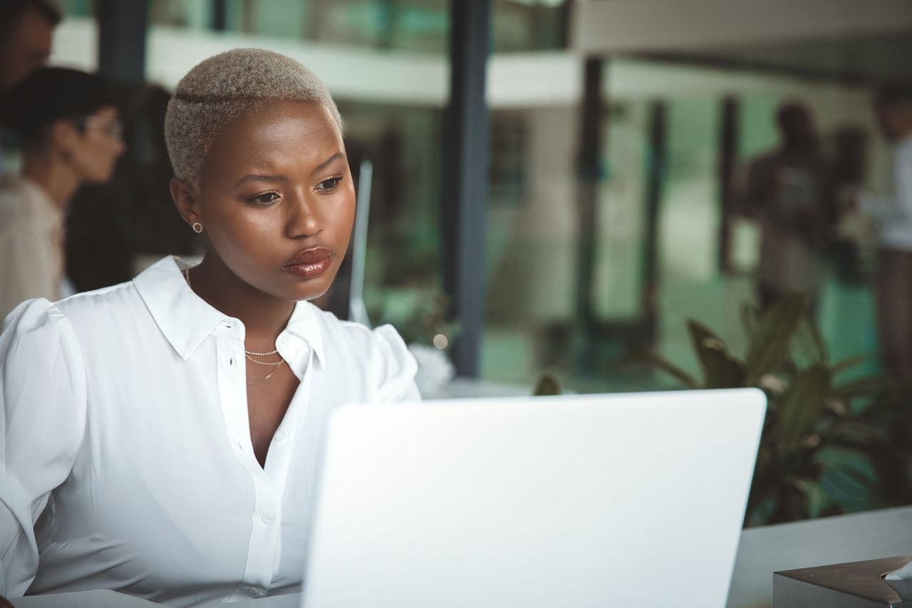Business woman working at her computer at the office